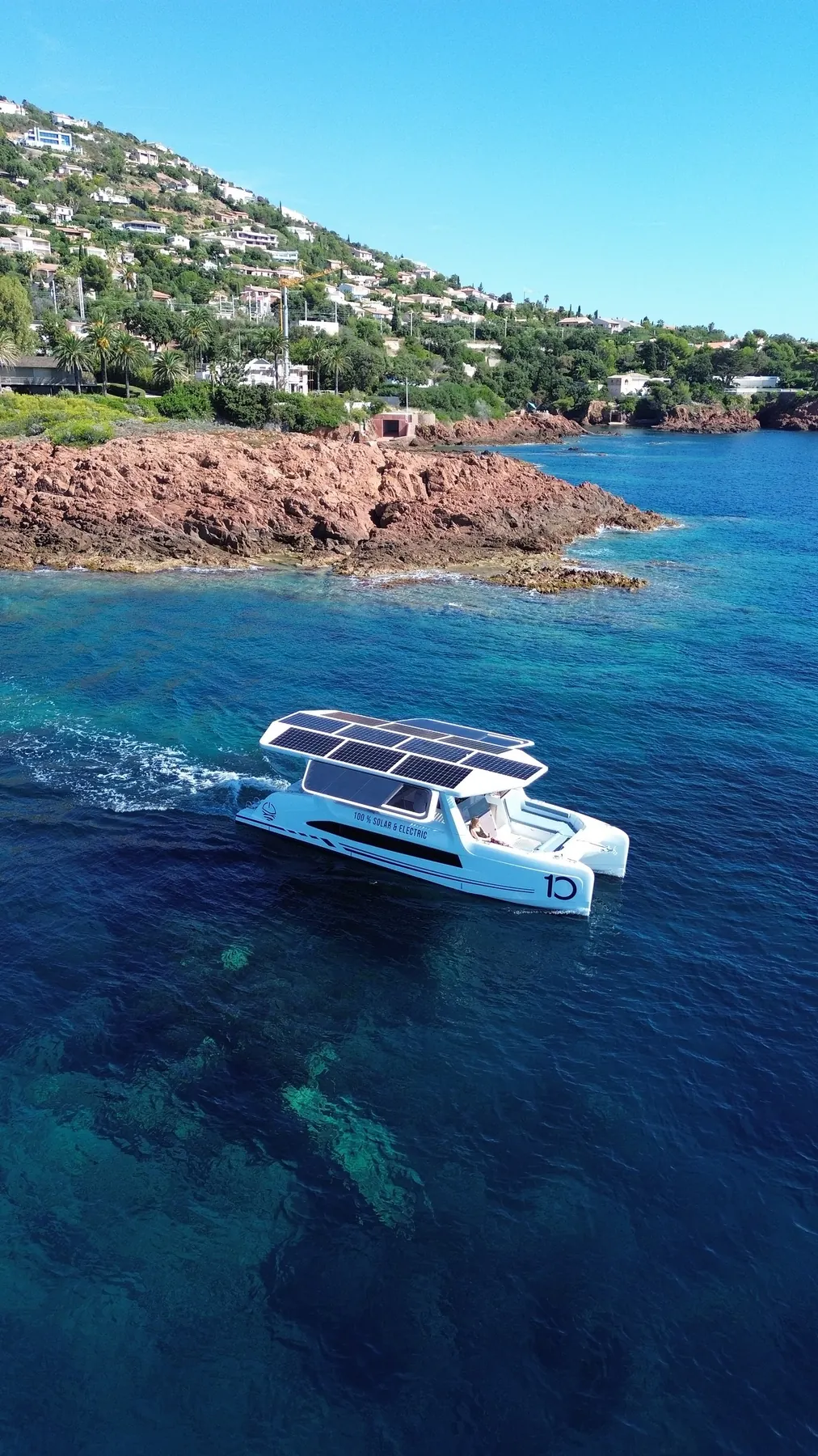 The M10 in a clear cove below a rocky headland